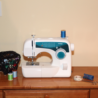 BROTHER® Freedom Sewing Machine - This versatile sewing machine is perfect for sewing, quilting, decorating clothing, crafts and creating home décor items.  It features 25 built-in utility, decorative and heirloom stitches, each with multiple stitch functions, an automatic needle threader, built-in thread cutter, automatic 1-step buttonholer, drop-in bobbin and automatic bobbin winding system.